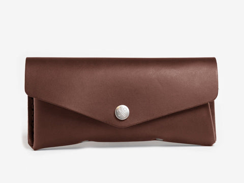 A brown leather wallet with a silver button closure, displayed against a plain white background.