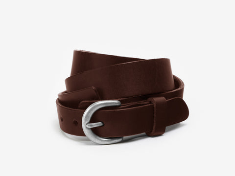 A coiled dark brown leather belt with a matte silver oval buckle, displayed on a plain white background.
