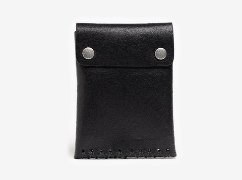 A black leather pouch with a flap secured by two silver snap buttons and decorative stitching along the bottom edge, displayed against a plain white background.