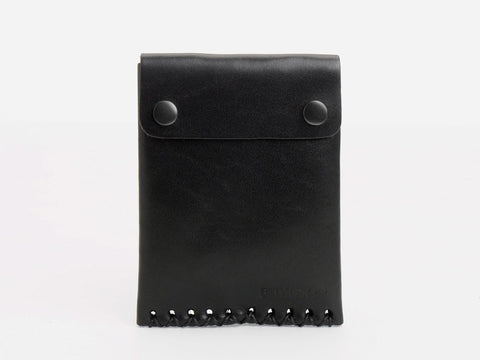 A black leather pouch with a flap secured by two snap buttons and decorative stitching along the bottom edge.