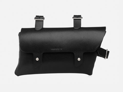 A black leather bicycle saddle bag with two buckled straps on top and a flap secured by two metal button studs on the front.