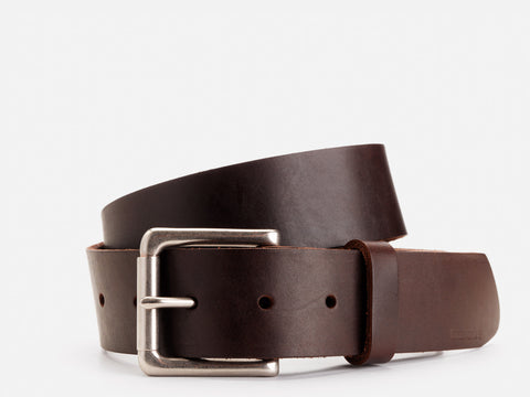 A dark brown leather belt with a silver rectangular buckle, neatly coiled against a plain white background.