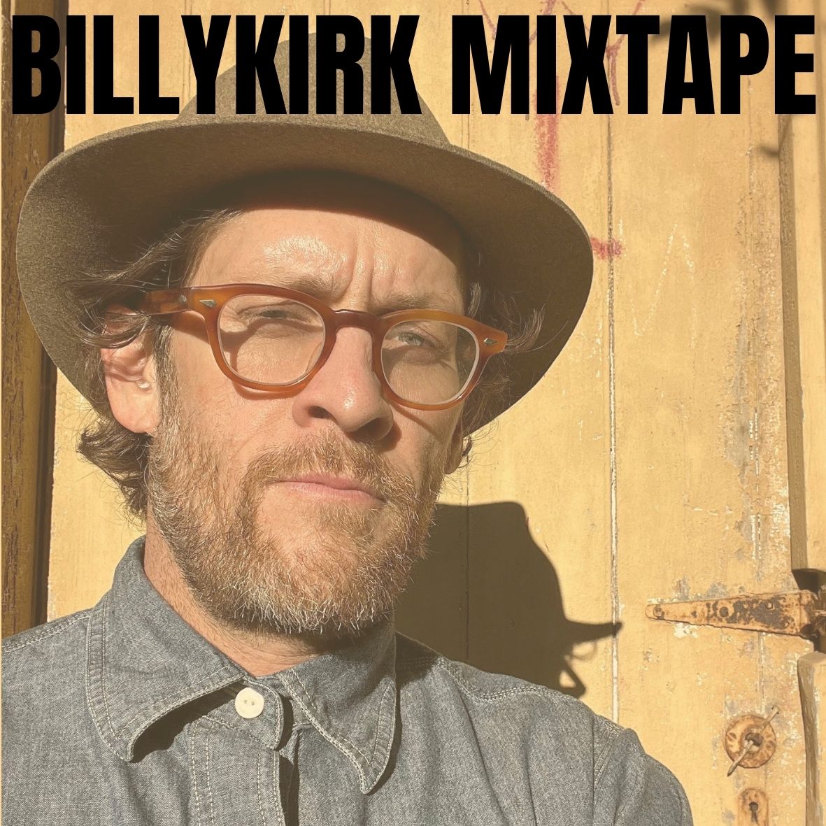 Man in hat with glasses in front of a wooden door with Billykirk Mixtape 