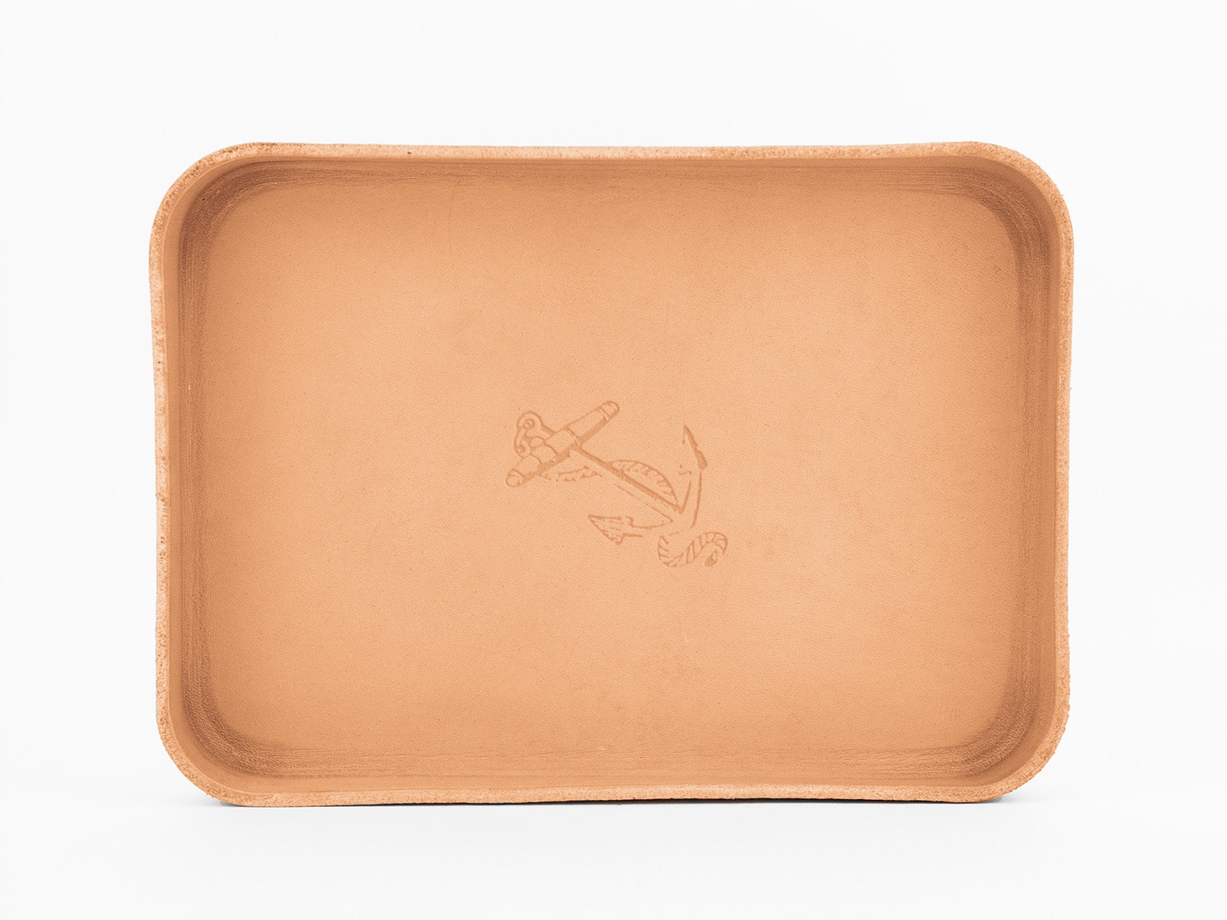 A rectangular, light brown leather tray with raised edges and an engraved anchor design in the center. The tray is photographed on a white background.