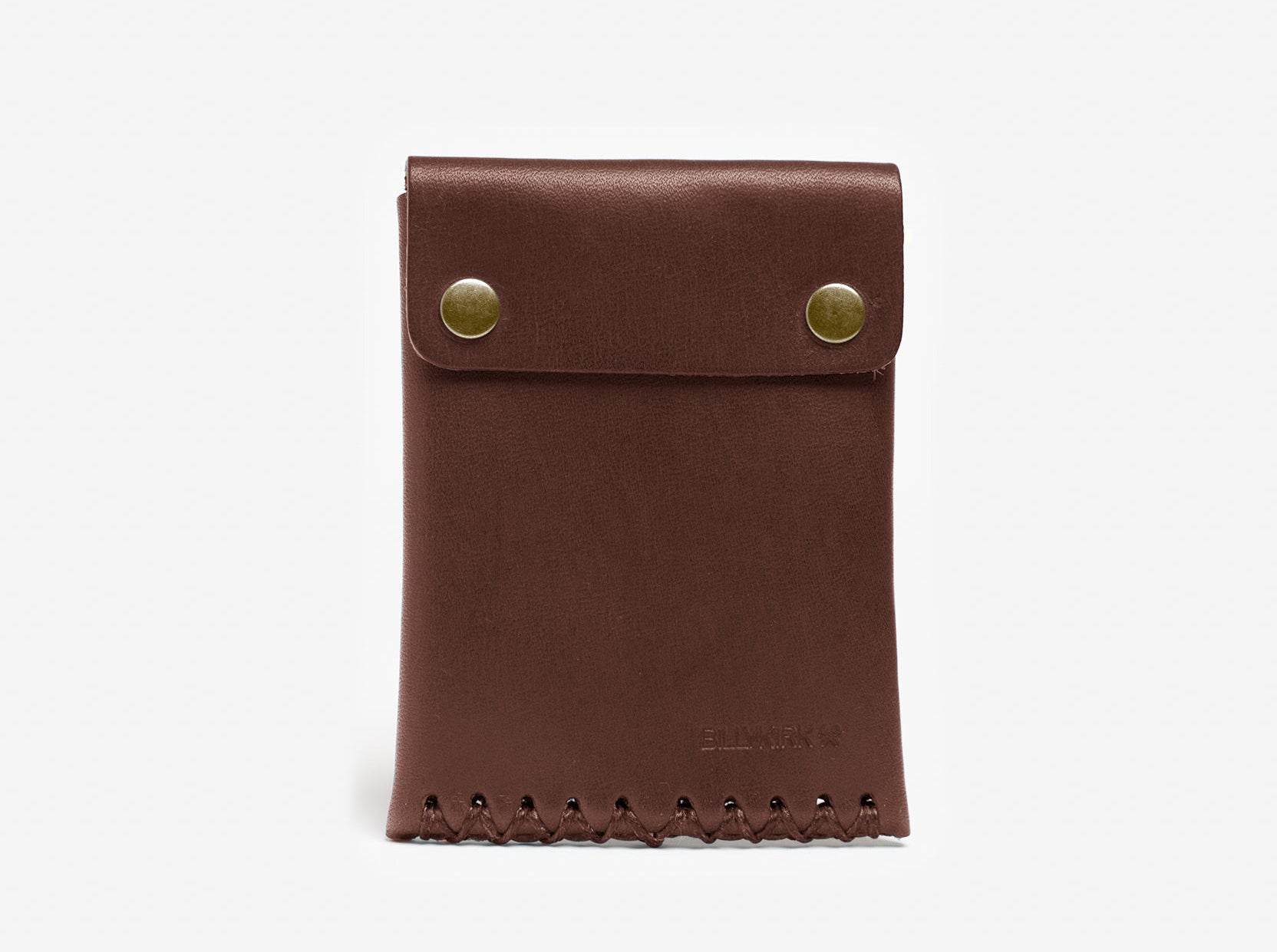 A brown leather pouch with two brass snap buttons and visible stitched detailing along the bottom edge, displayed against a plain white background.