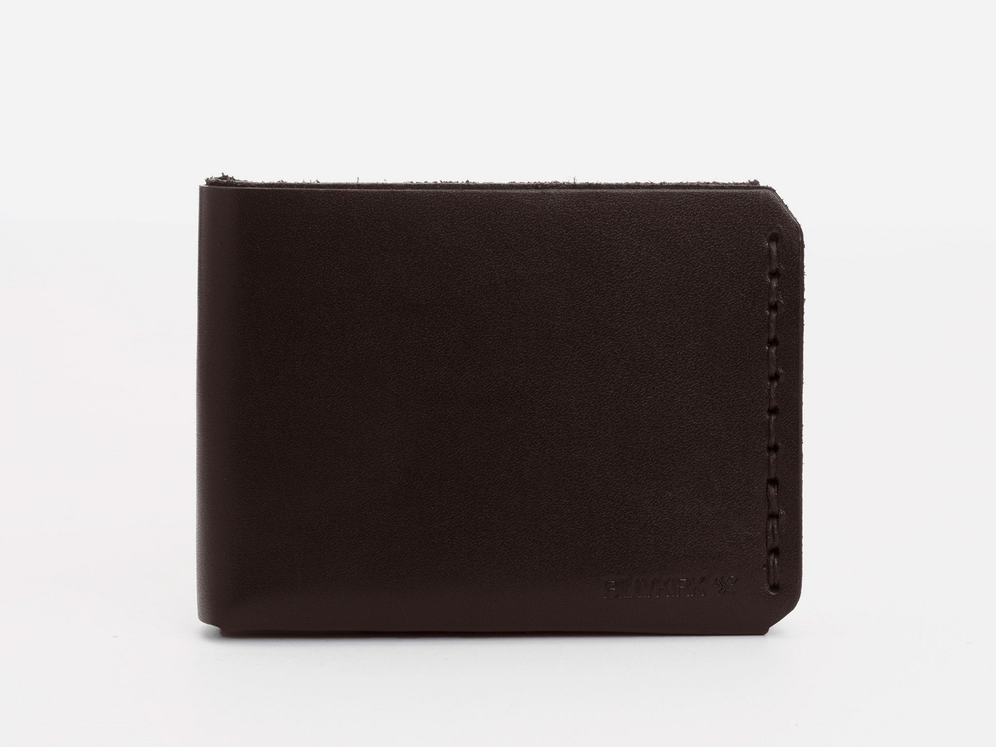 A dark brown leather wallet is displayed closed against a plain white background. The wallet features visible stitching on the right edge and a subtle embossed logo at the bottom right corner.