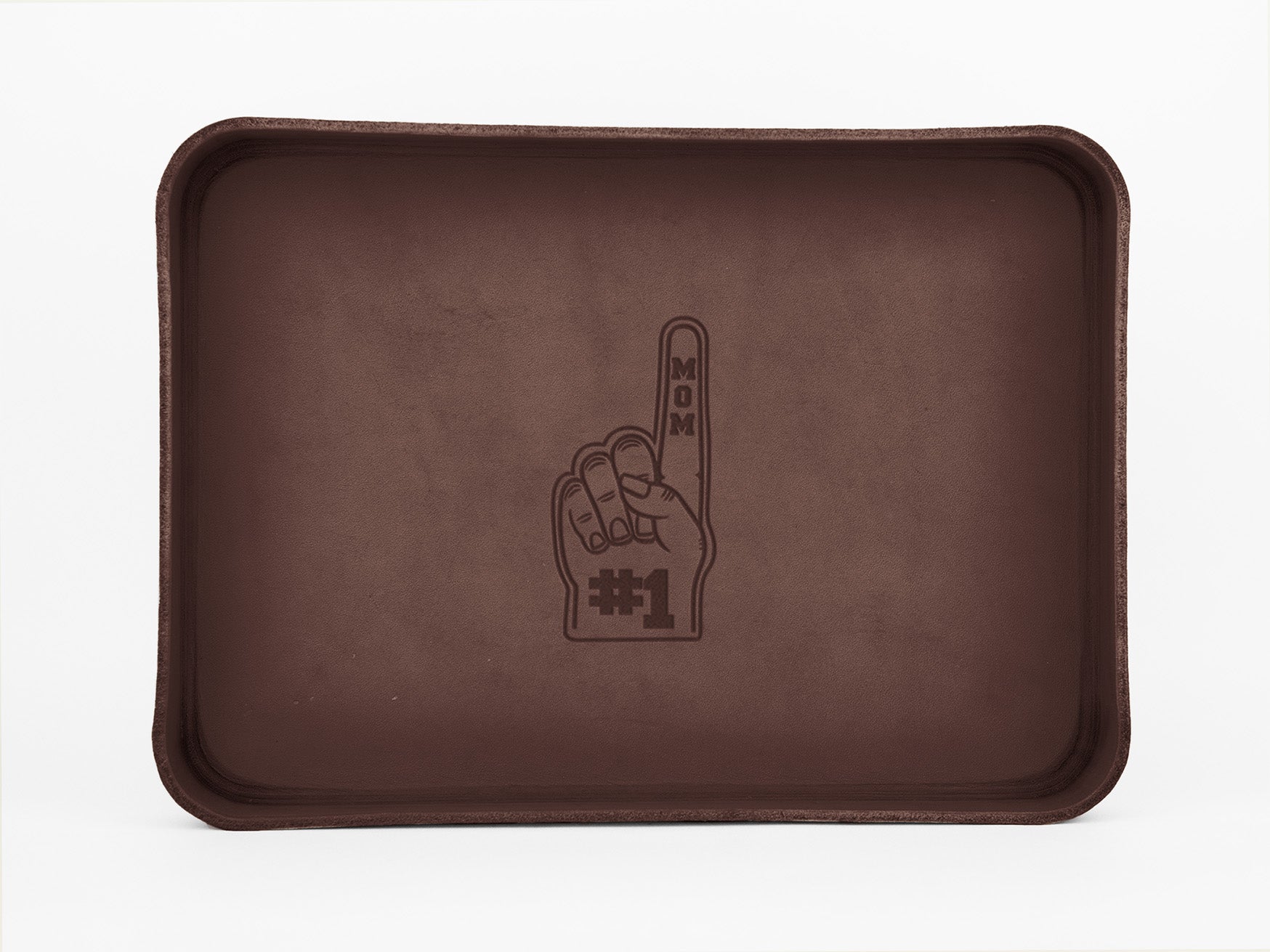 A brown rectangular tray featuring an illustration of a foam finger with the words MOM on the finger and #1 on the palm, centered on the tray.