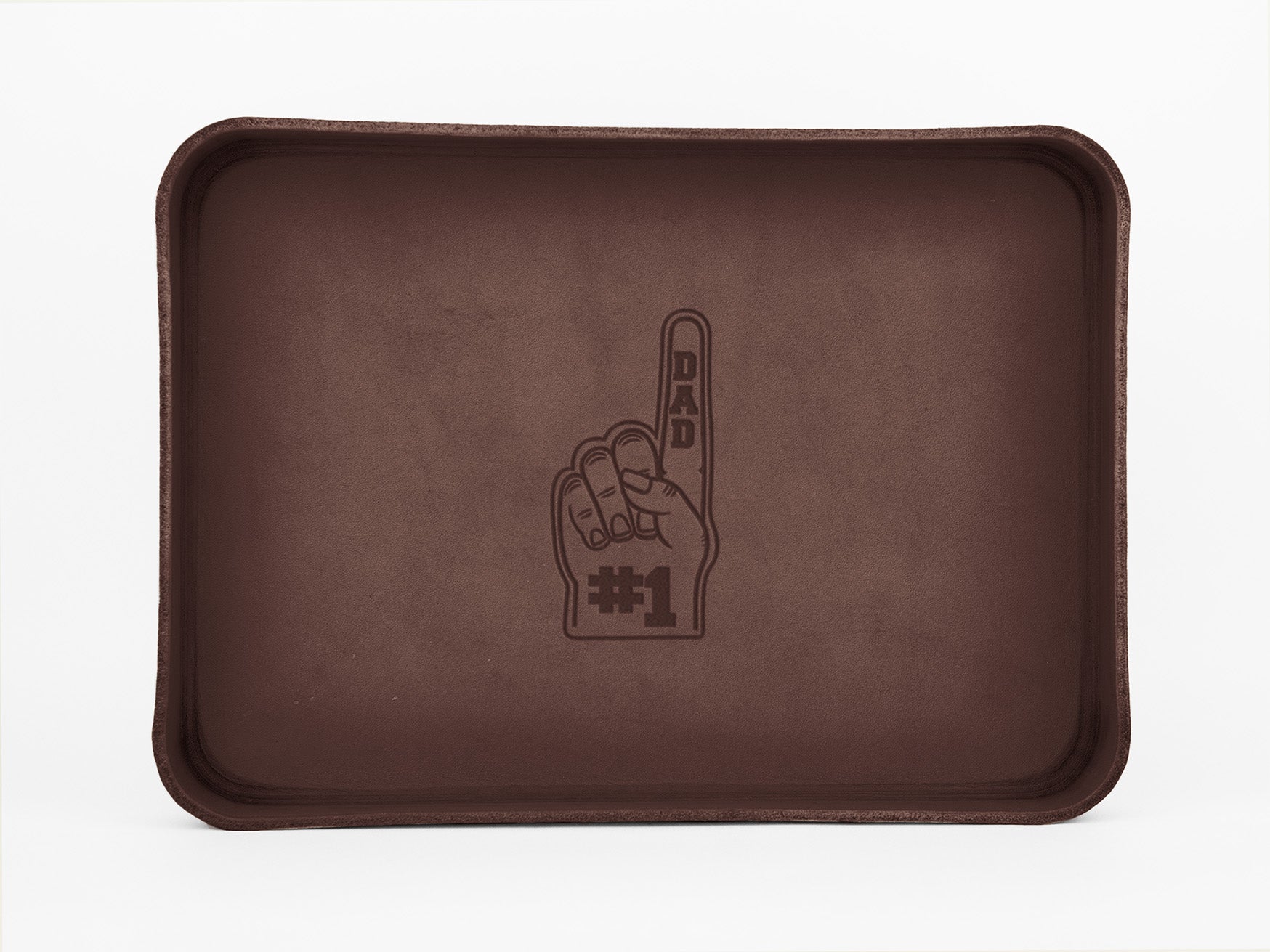 A brown rectangular tray featuring an illustration of a foam finger with DAD written on the finger and #1 on the palm, centered on the tray.
