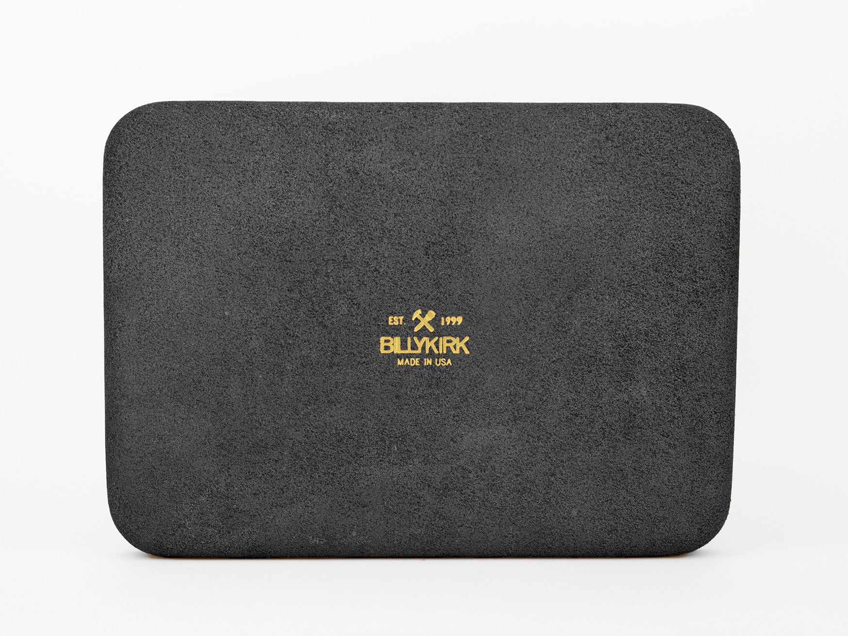A rectangular black leather pad with a slightly textured surface. In the center, gold text reads EST 1999, BILLYKIRK, and MADE IN USA with a small crossed mallet and knife graphic above the brand name.