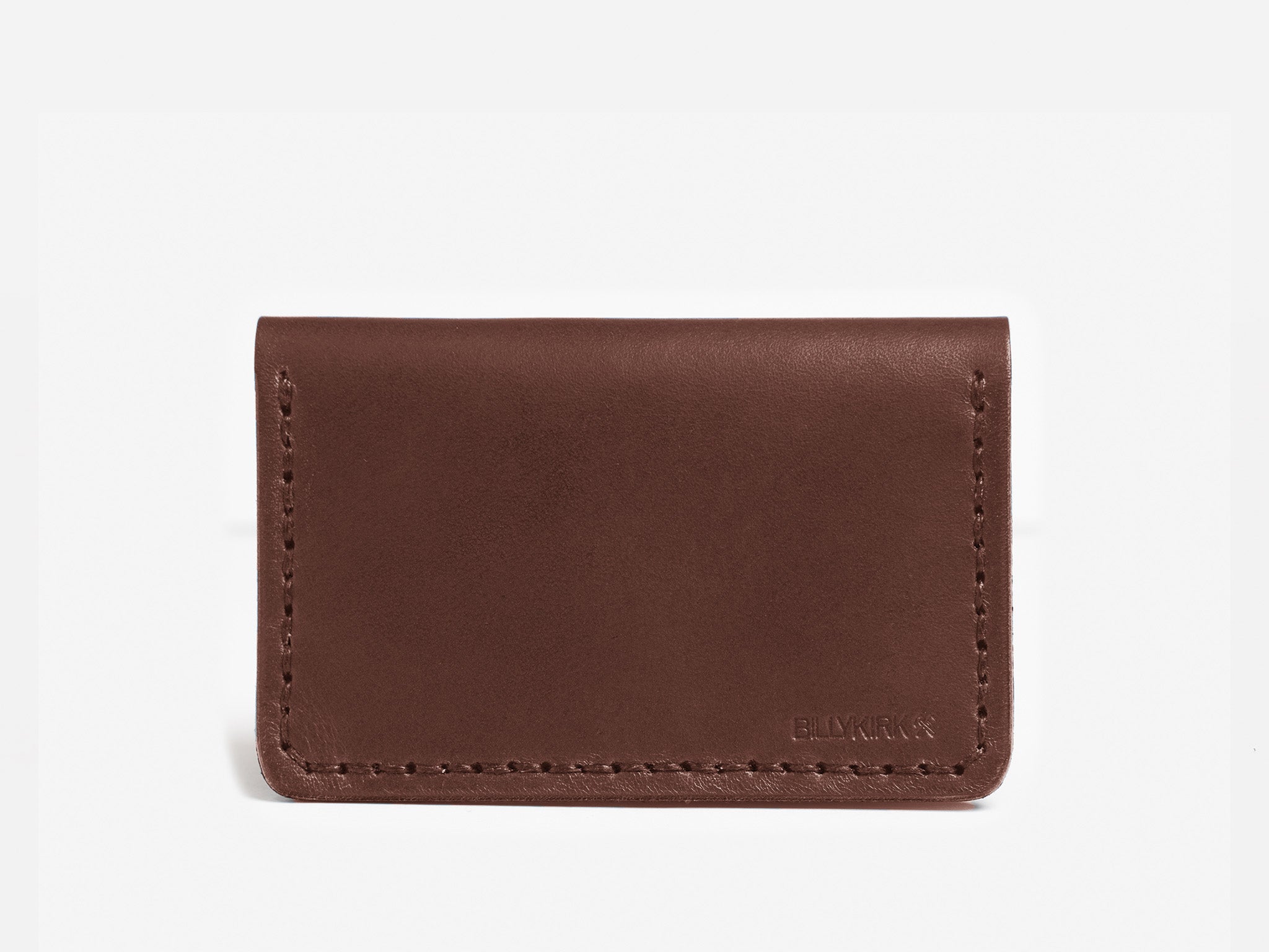 A simple brown leather cardholder with visible stitching along the edges, set against a plain white background. The word BELLROY is subtly embossed in the bottom right corner.
