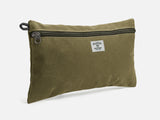 An olive waxed canvas pouch with zipper closure on a neutral background. It features a cream woven tag that reads "Billykirk made in america since 1999".