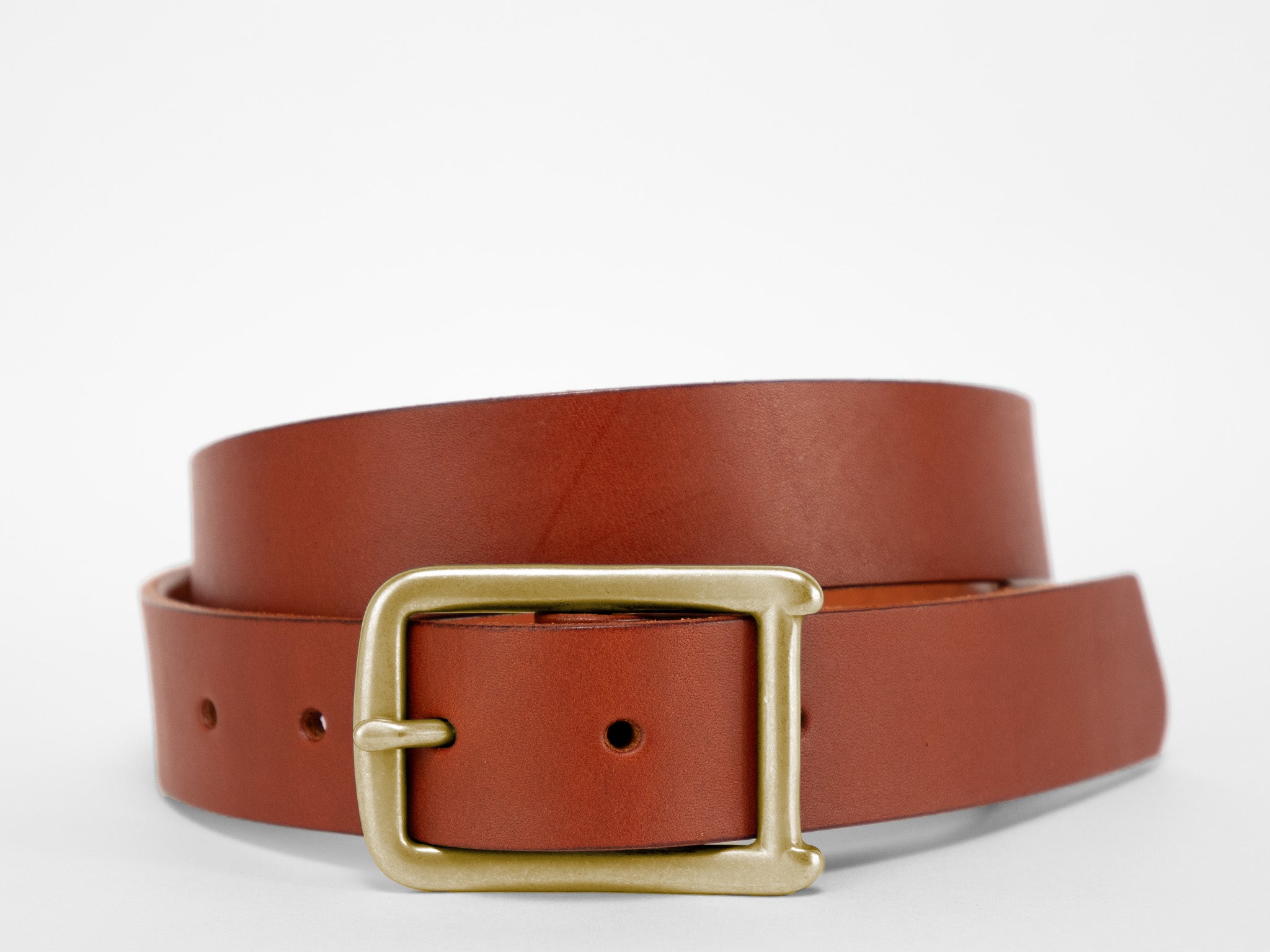 A brown leather belt with a gold rectangular buckle, coiled neatly on a white background.