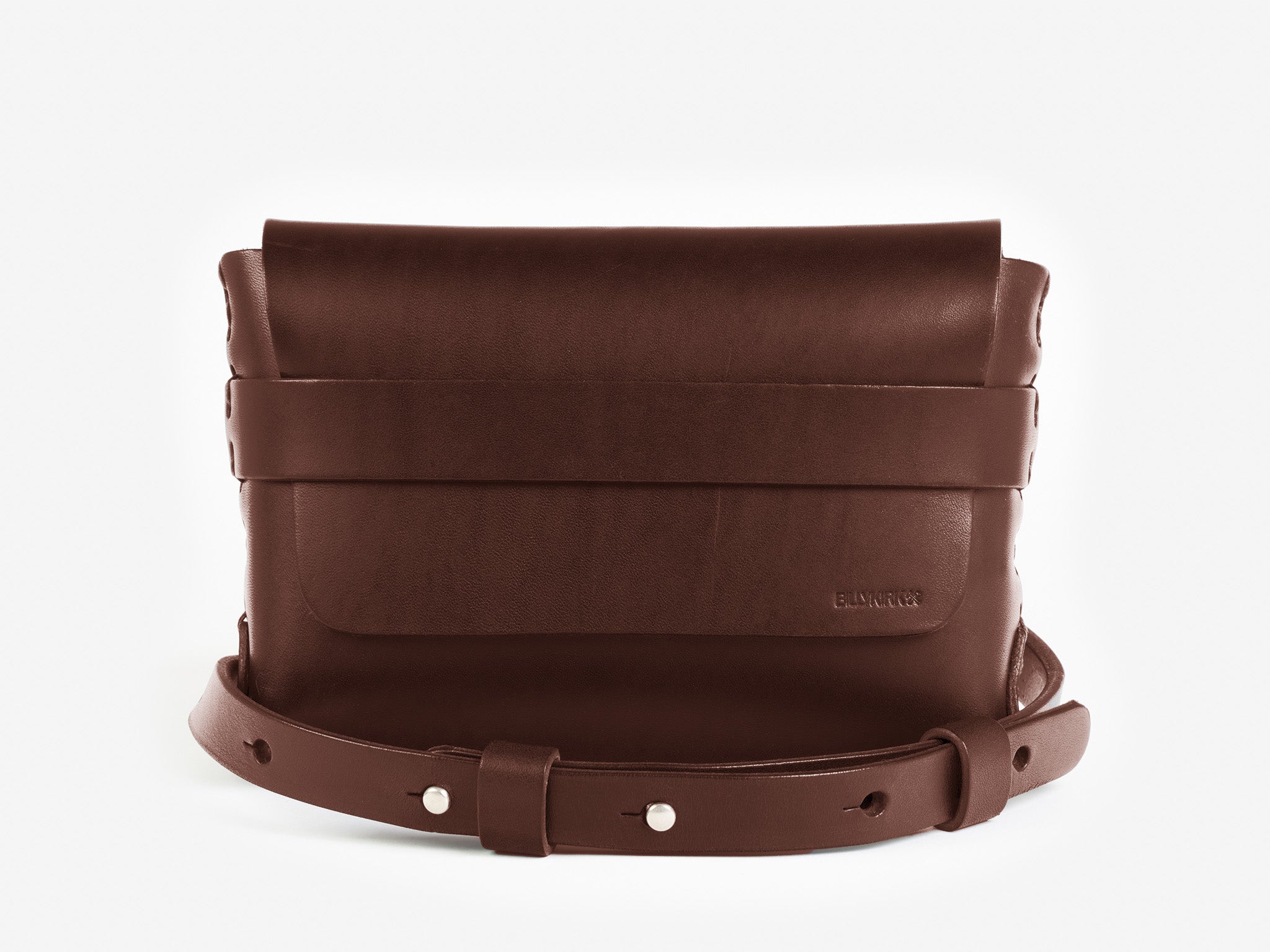 A hickory leather belt crossbody bag with a smooth finish, featuring a flap closure, subtle embossed branding, and an adjustable strap with silver-tone collar buttons, displayed against a white background.