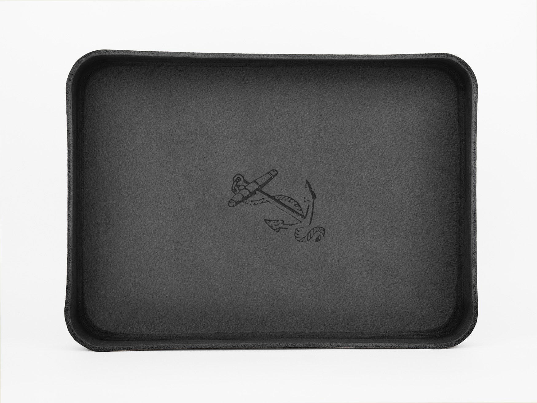 A rectangular black tray with raised edges and an illustration of an anchor and rope in the center on a plain white background.