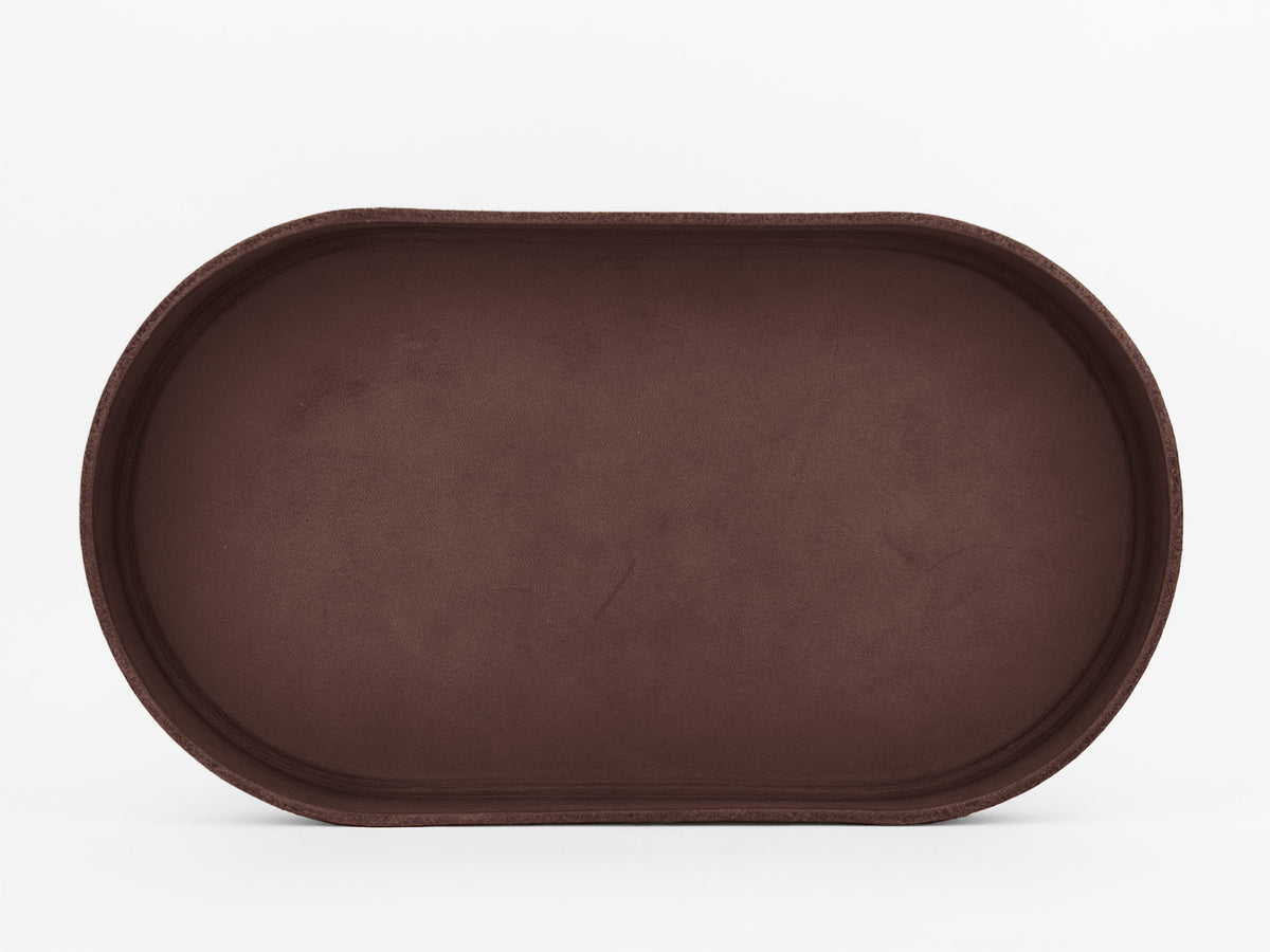 A plain, oval-shaped, brown tray with slightly raised edges is shown against a white background.