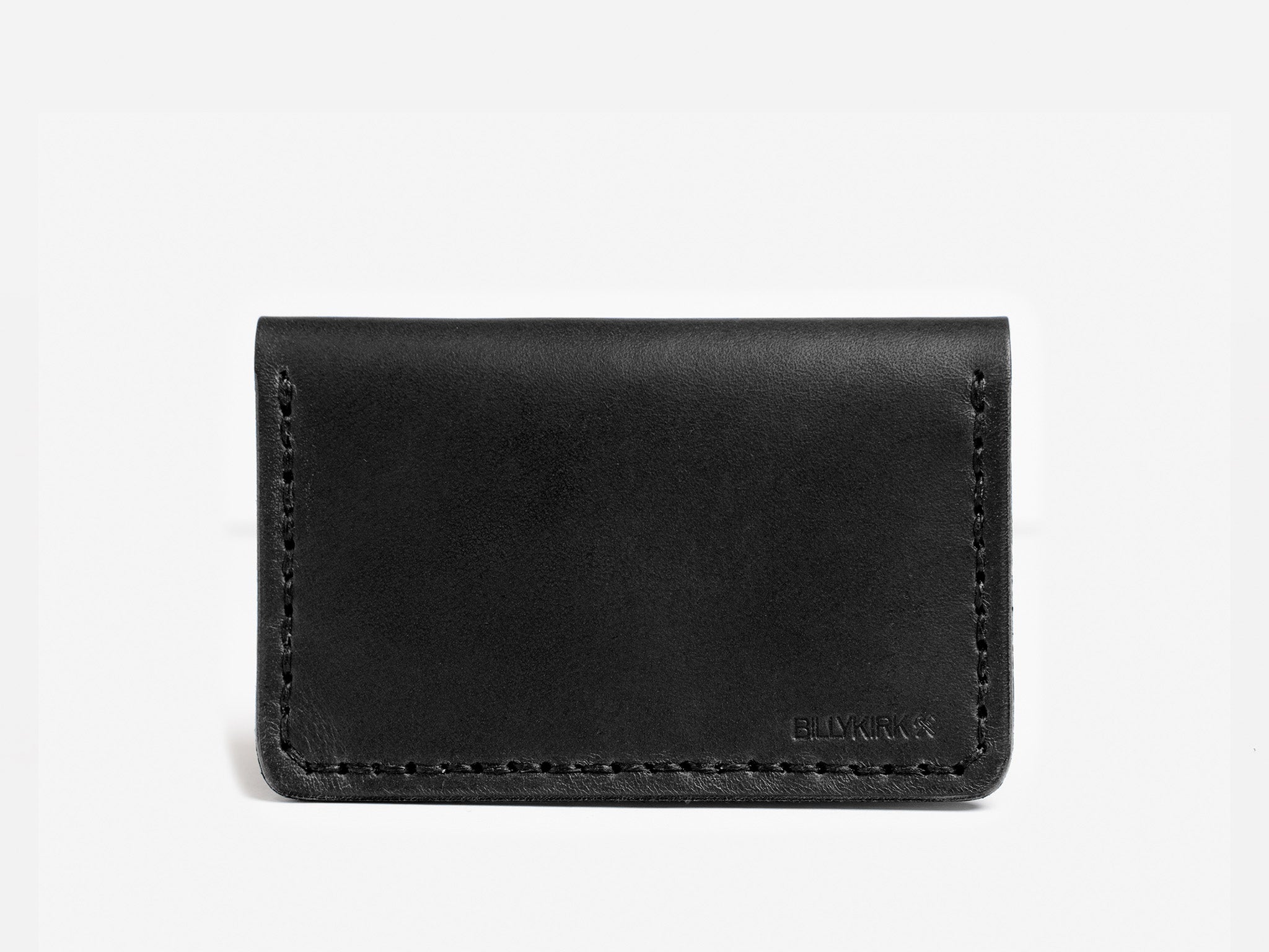 A minimalist black leather wallet with visible stitching and the word BLYKRKR embossed in the lower right corner, shown against a plain white background.