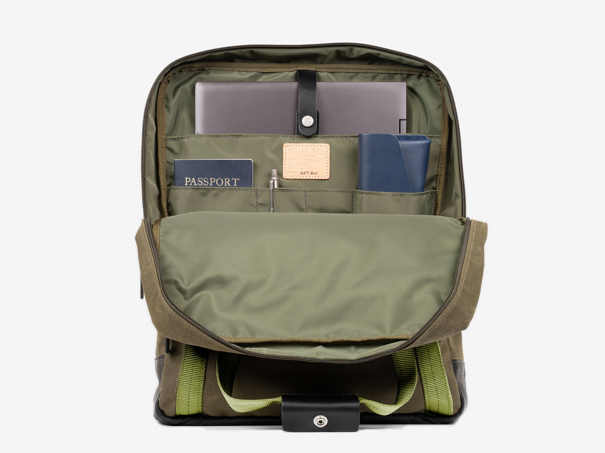 A neatly organized backpack with its front flap open, revealing a laptop, a passport, a pen, a blue notebook, and several compartments holding various items.