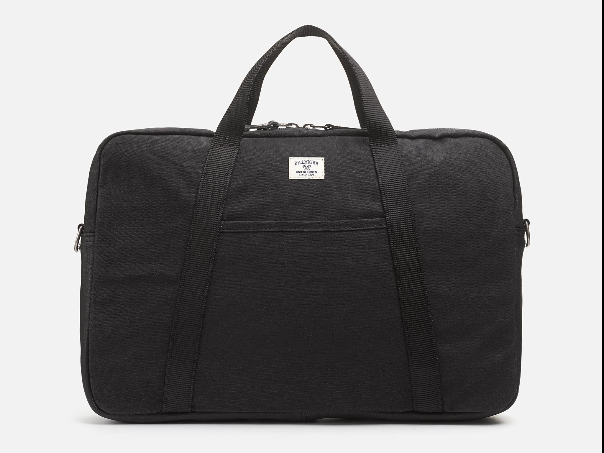 A black fabric briefcase with two handles and a front pocket, featuring a small white label at the top center. The bag is photographed against a plain white background.