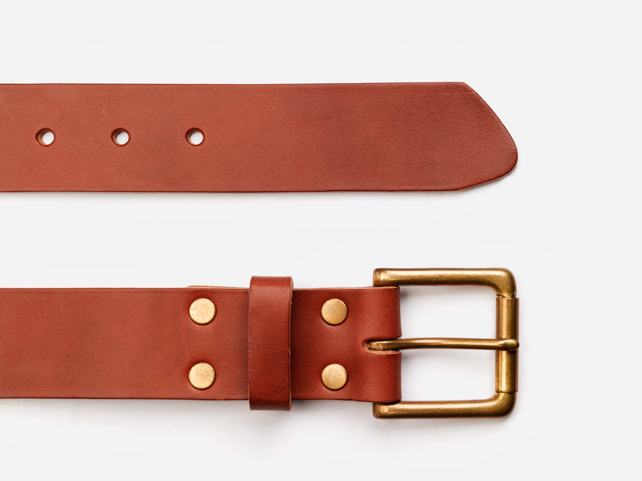 A brown leather belt with a gold buckle and rivets, shown laid flat on a white background. The belt has five holes and a pointed tip.