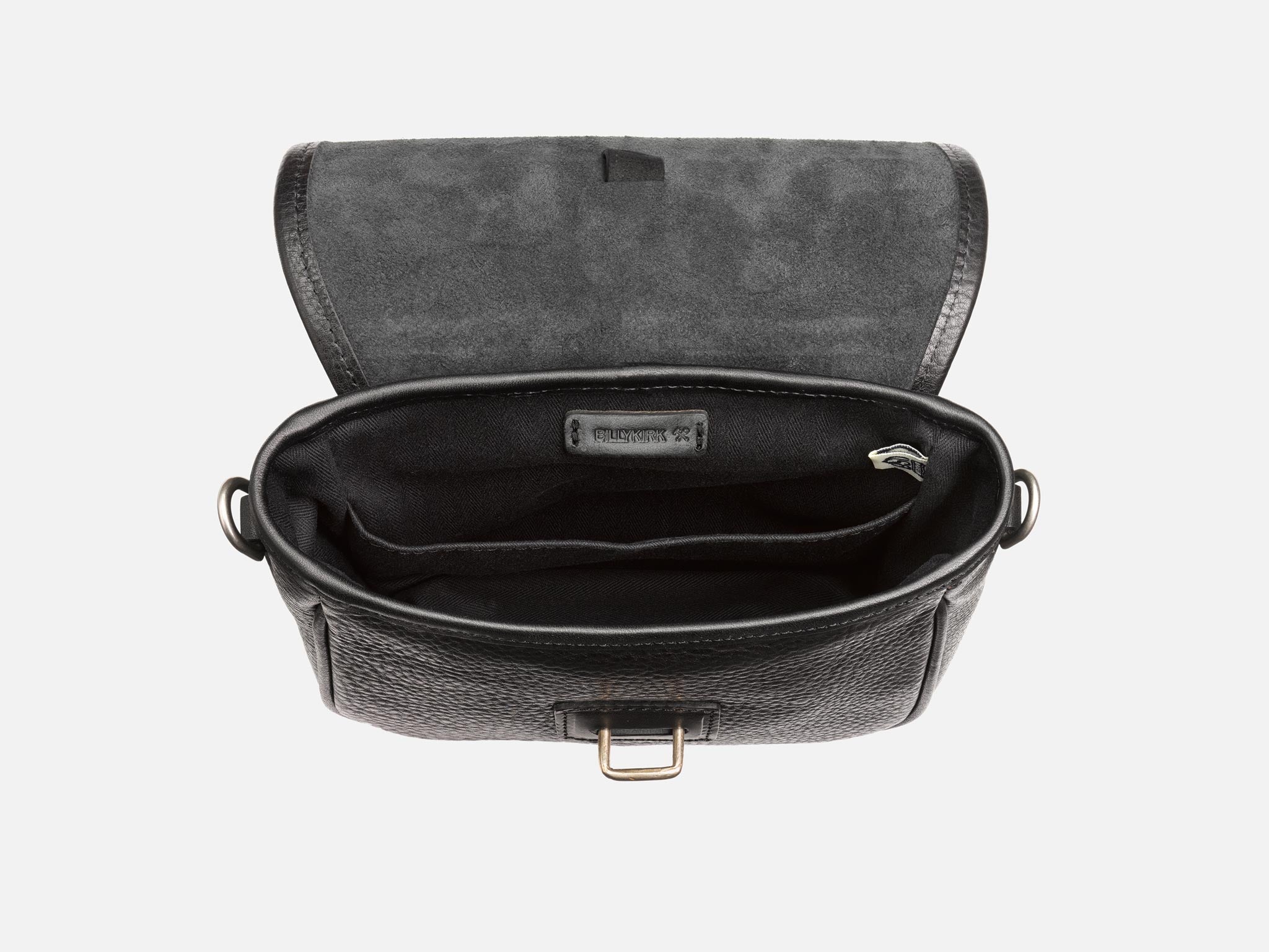 Open black leather crossbody bag with a fabric-lined interior, showing multiple compartments and a zippered pocket inside. The lid is flipped back, revealing the textured leather exterior and suede interior flap.