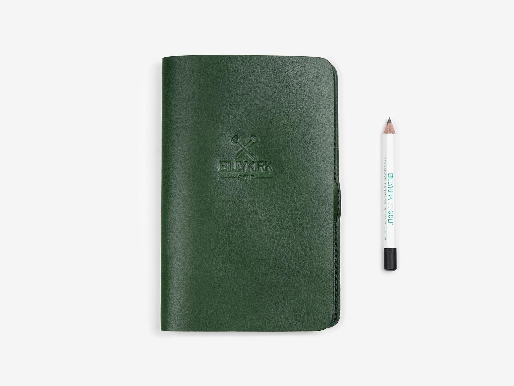 A green full grain cowhide leather scorecard holder with a white golf pencil, embossed with a logo.